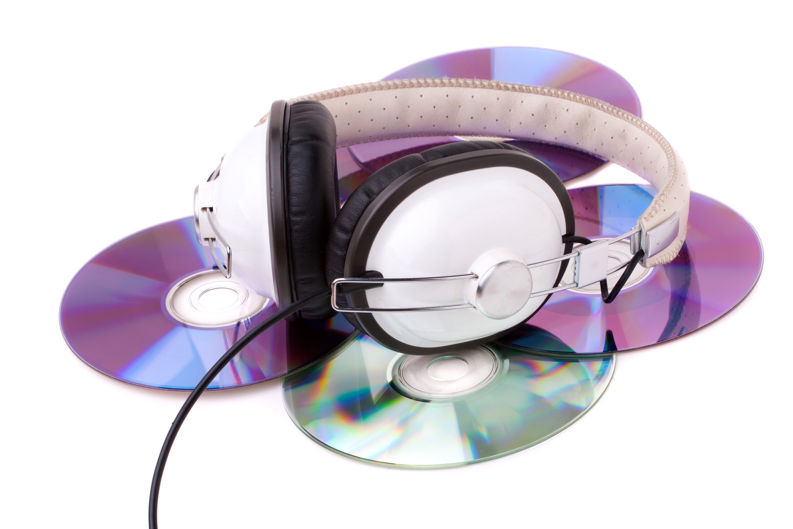 Headphones And Cds On A White Background.